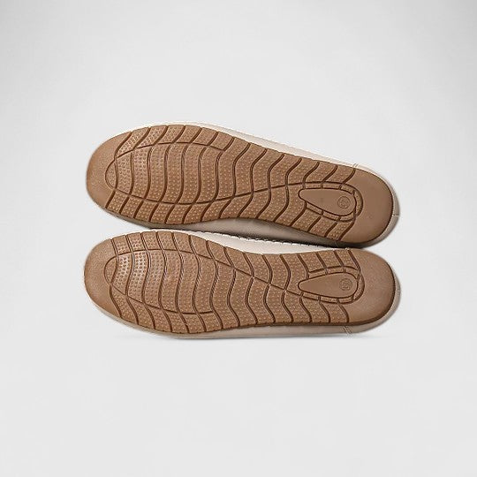 Women's perforated slip on flats styled for warm weather with casual denim outfit