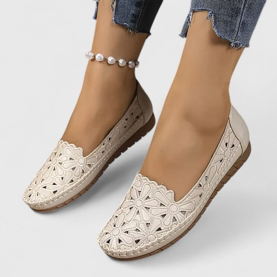 Women's perforated slip on flats featuring breathable design and closed-toe silhouette for everyday wear