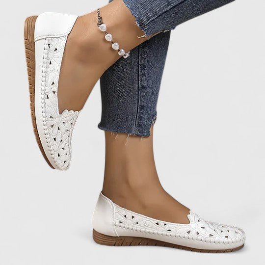 Multiple color options of women's perforated slip on flats in white and beige shades