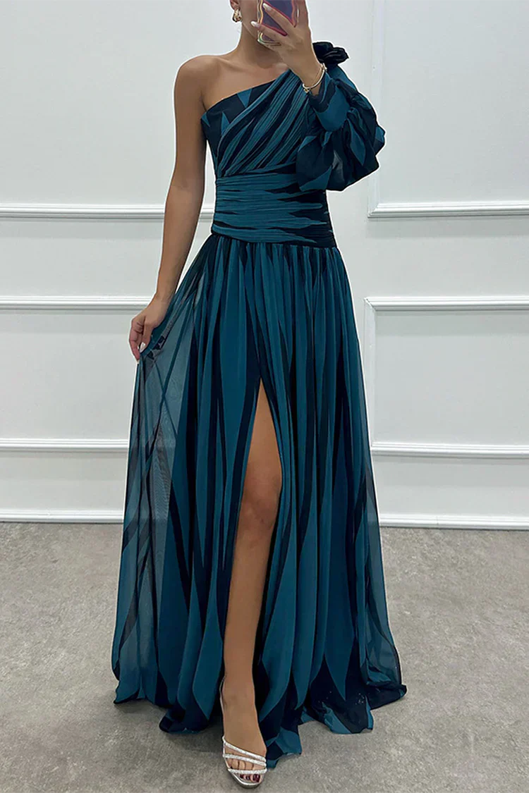Back view of one shoulder evening dress showing flowing floor length silhouette and drape