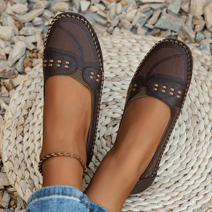 Side profile of women's orthopedic slip on loafers in beige displaying contoured insole and flexible sole