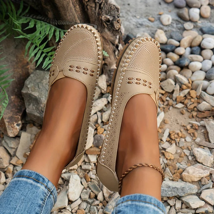 Overhead view of women's orthopedic slip on loafers in coffee shade with decorative cutout strap detail