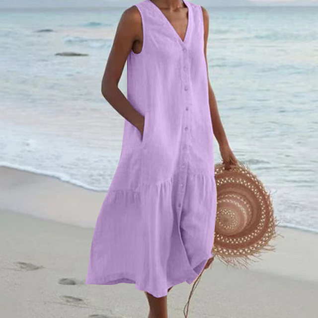Full-length view of relaxed-fit linen beach dress styled with woven accessories