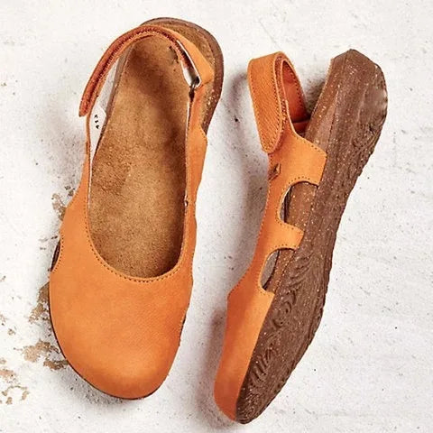 Detailed shot of women's slingback orthopedic sandals featuring metal buckle closure and cushioned insole construction