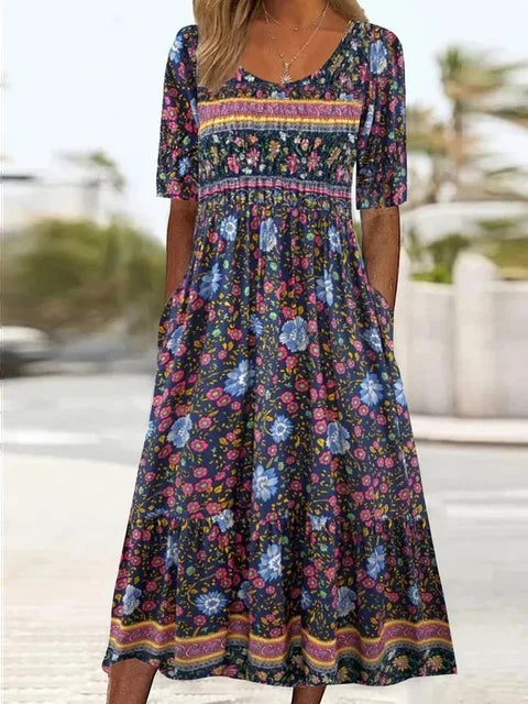Midi-length dress showcasing intricate floral pattern and decorative border trim at hem
