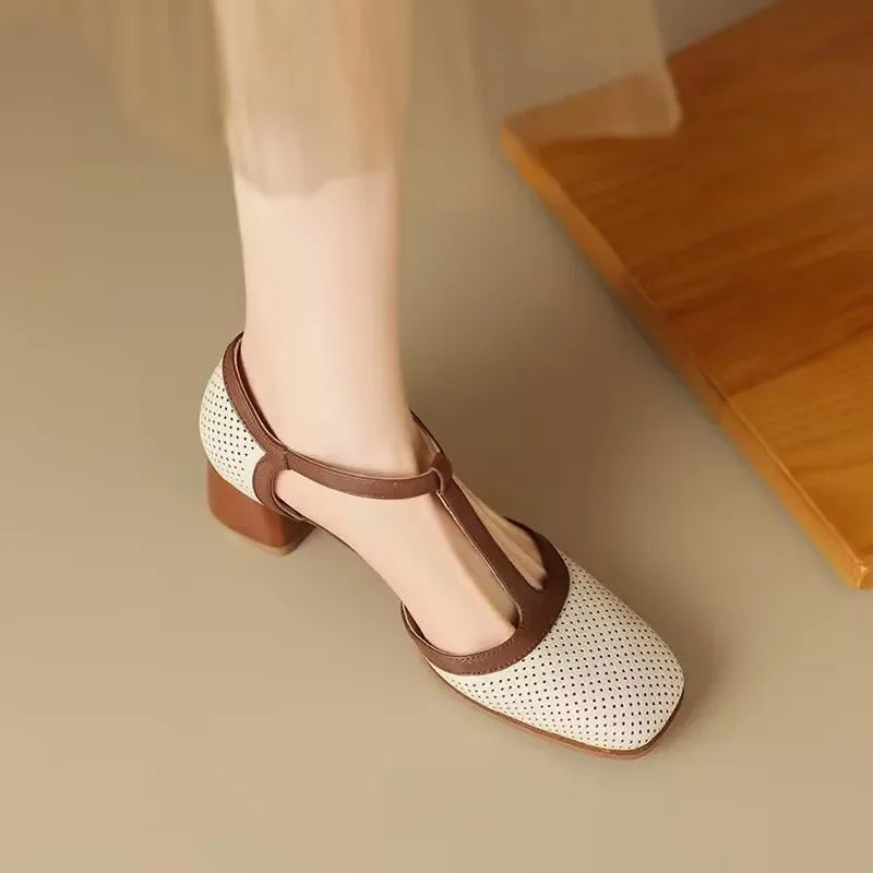 Side angle of Women's T-Strap Block Heel Shoes displaying mid-height block heel and two-tone styling