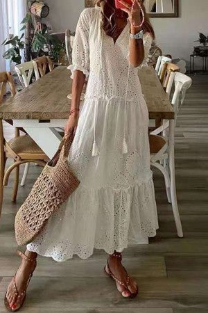 Full-length view of women's boho floral short sleeve maxi dress styled with sandals