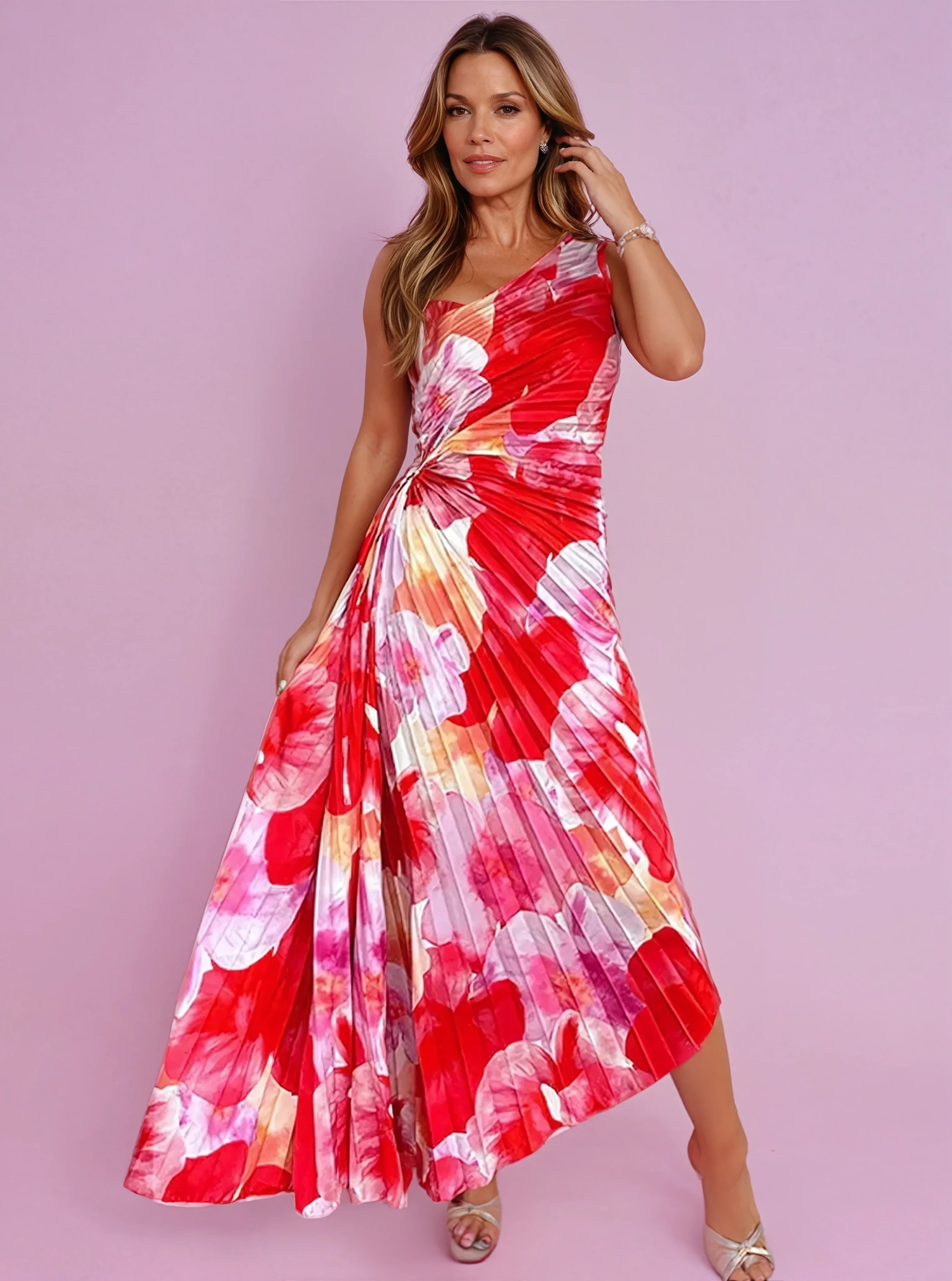 Pleated summer dress with one shoulder design and vibrant floral print in warm tones