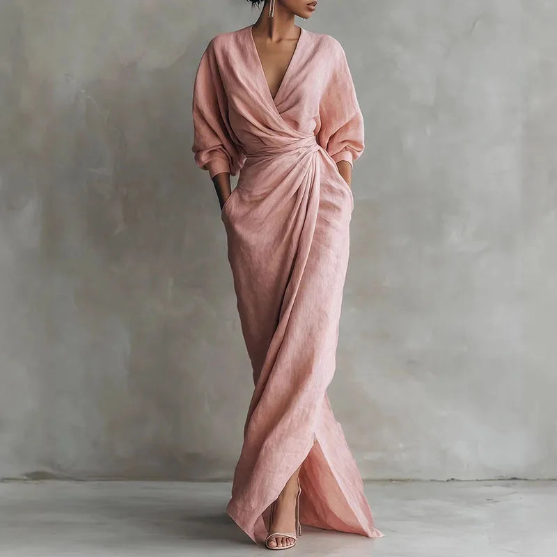 Bella V Neck Wrap Waist Long Dress in blush pink with deep neckline and draped silhouette on model