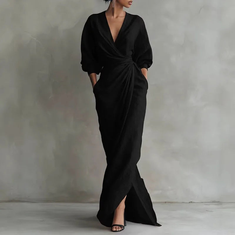 Back view of long sleeve wrap dress showing draped fabric and silhouette