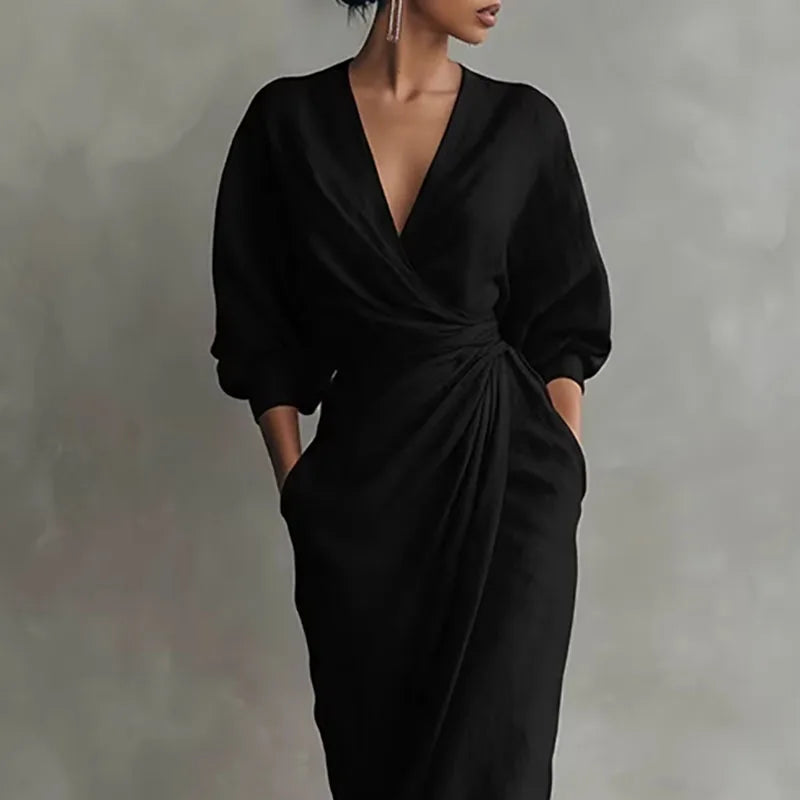 Detail of deep V neckline and sleeve construction on wrap waist dress
