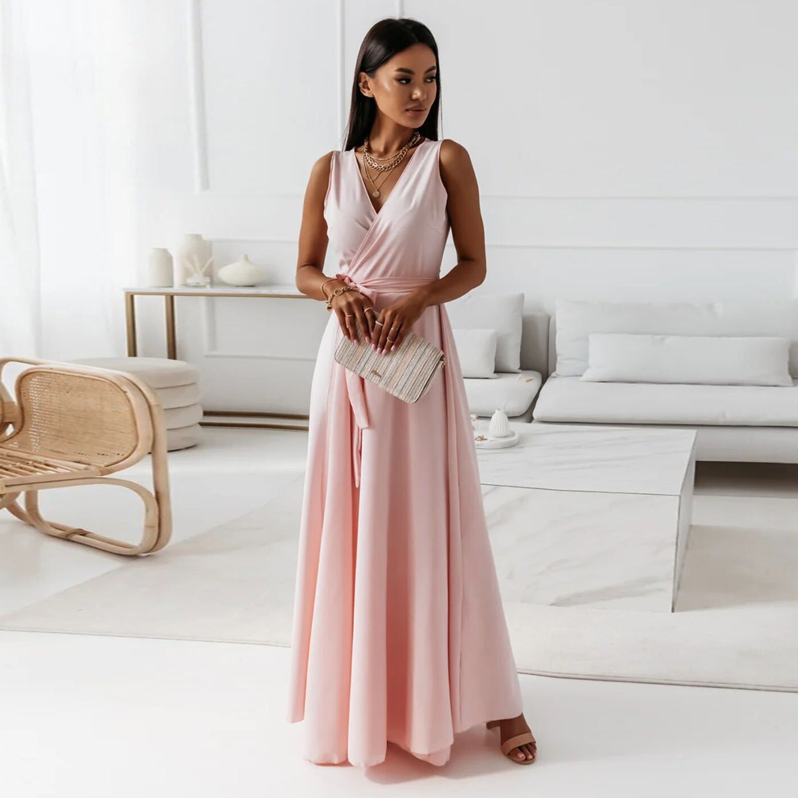 Women Wedding Guest Elegant Wrap Maxi Dress in pale pink with sleeveless V-neckline and flowing maxi skirt
