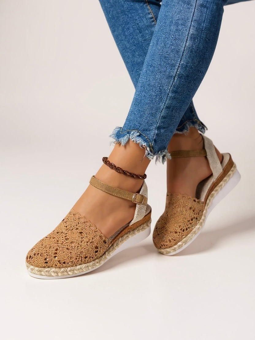 Boho wedge espadrille ankle strap sandals on foot from front angle highlighting cross-over strap and platform height