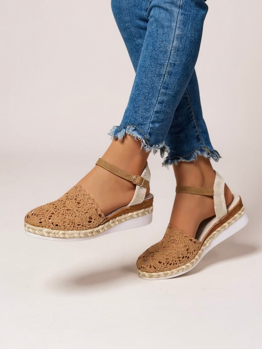 Boho wedge espadrille sandals worn with denim shorts displaying natural jute sole and relaxed silhouette