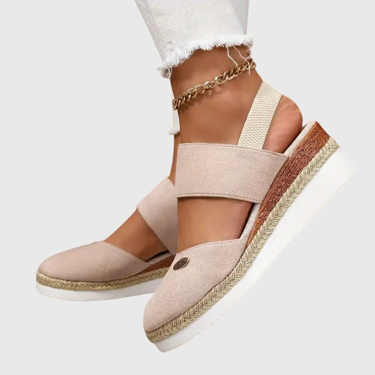 Women wearing beige orthopedic sandals with white athletic socks demonstrating all-day comfort and support