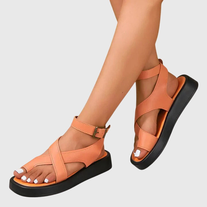 Women's Strappy Gladiator Platform Sandals in coral orange with crisscross straps and adjustable ankle buckle closure on platform sole