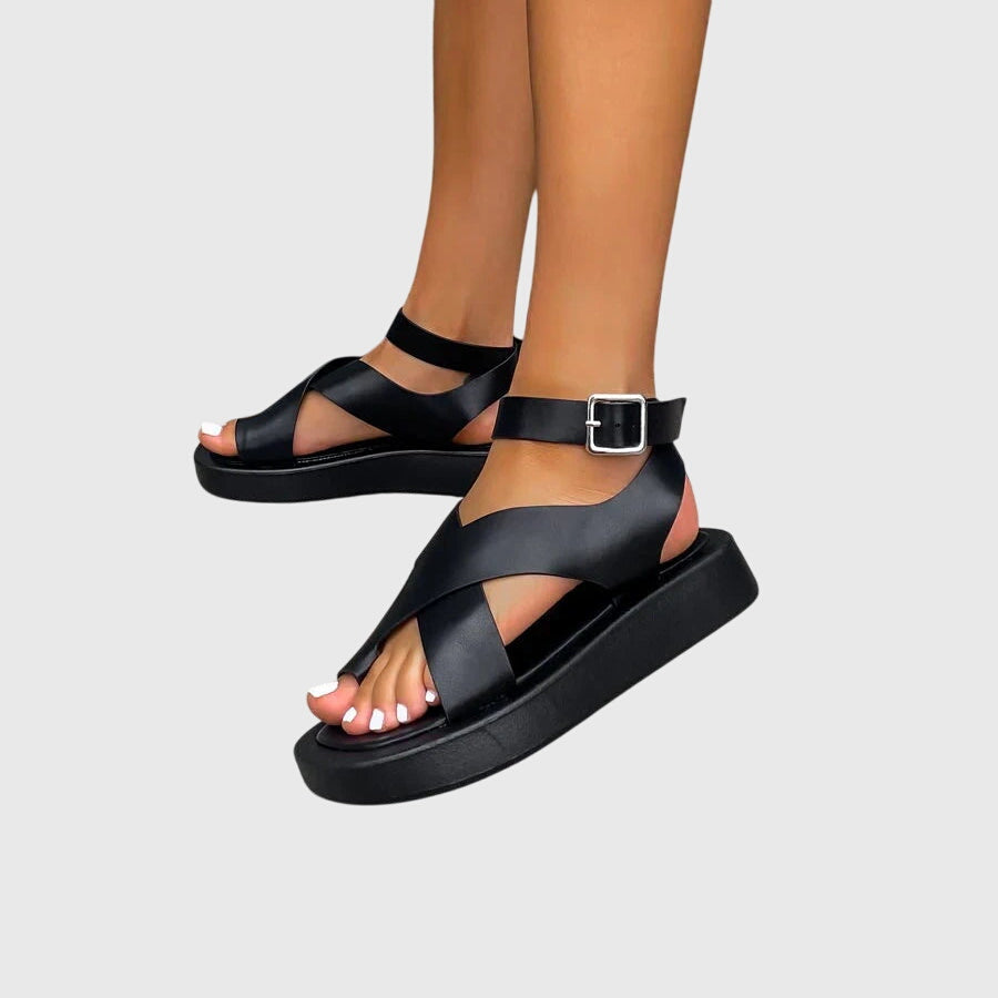 Multiple strap design detail on gladiator platform sandals showing structured material with visible topstitching and buckle hardware