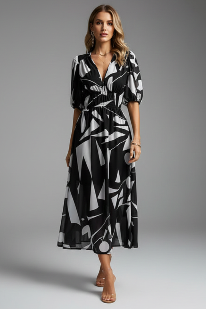 Back view of floral puff sleeve midi dress showing flowing silhouette and romantic summer styling