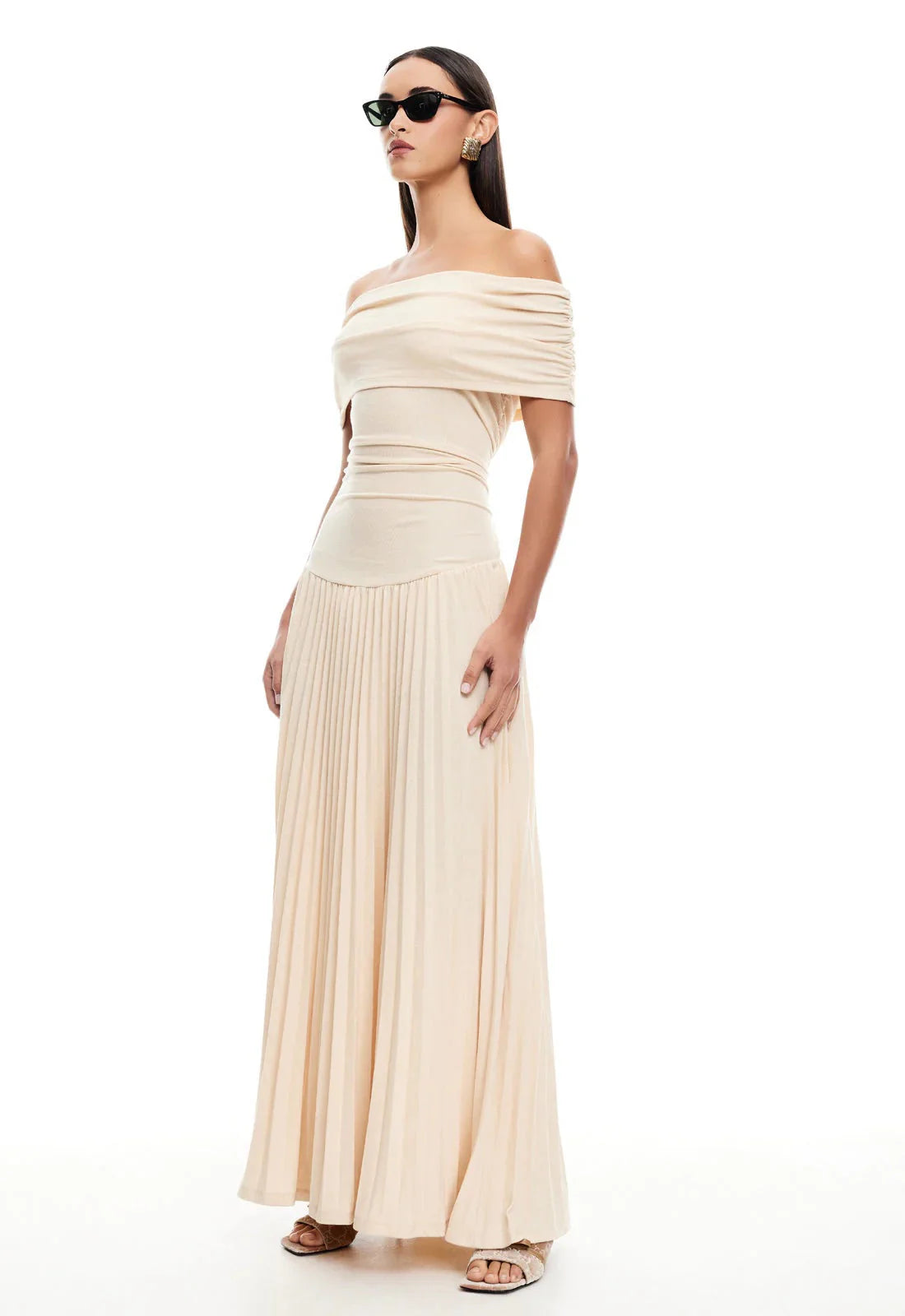 Full length view of flowing maxi dress with pleated skirt in neutral shade