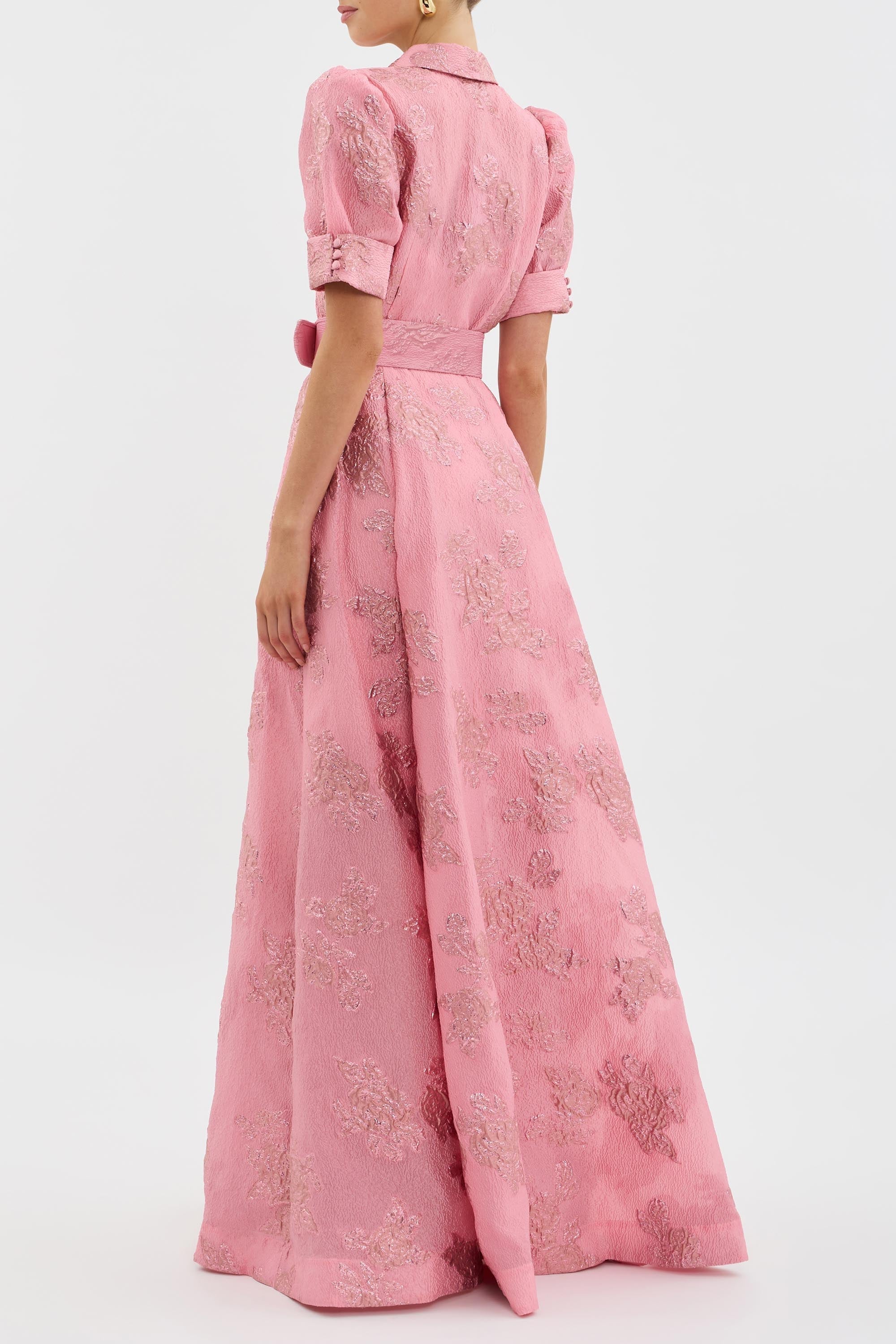 Pink floral jacquard maxi dress with puff sleeves and structured fabric for wedding guests