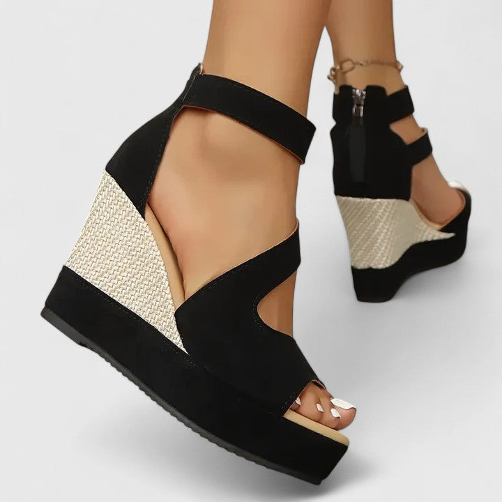 Detail shot of orthopedic wedge sandals featuring multiple elastic straps and open-toe design