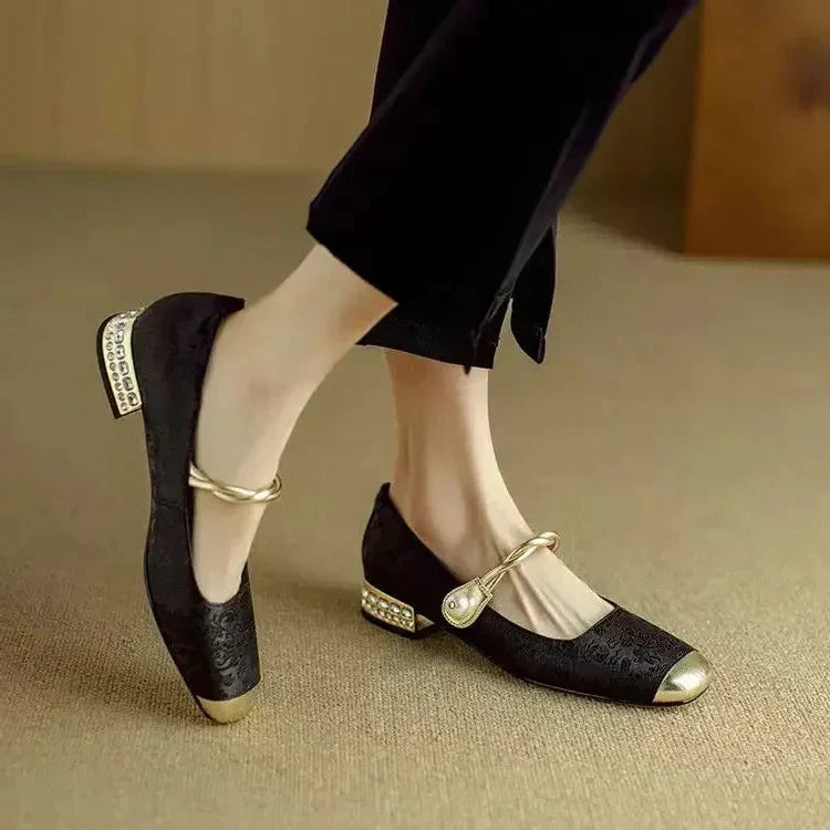 Black colorway of Women's Pearl Strap Mary Jane Shoes with glitter block heel and gold detailing