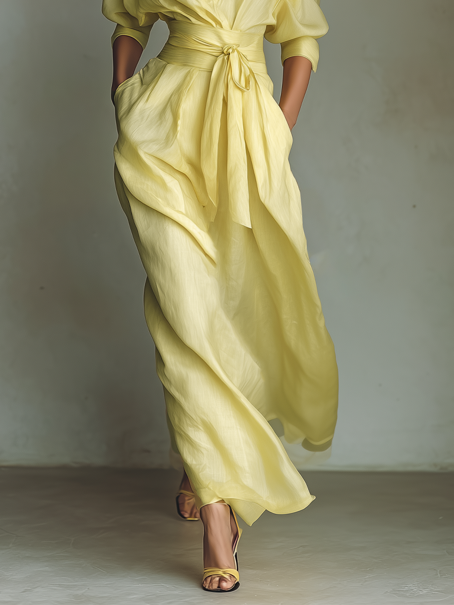 Detail shot of yellow cotton linen maxi dress V-neckline and button placket closure