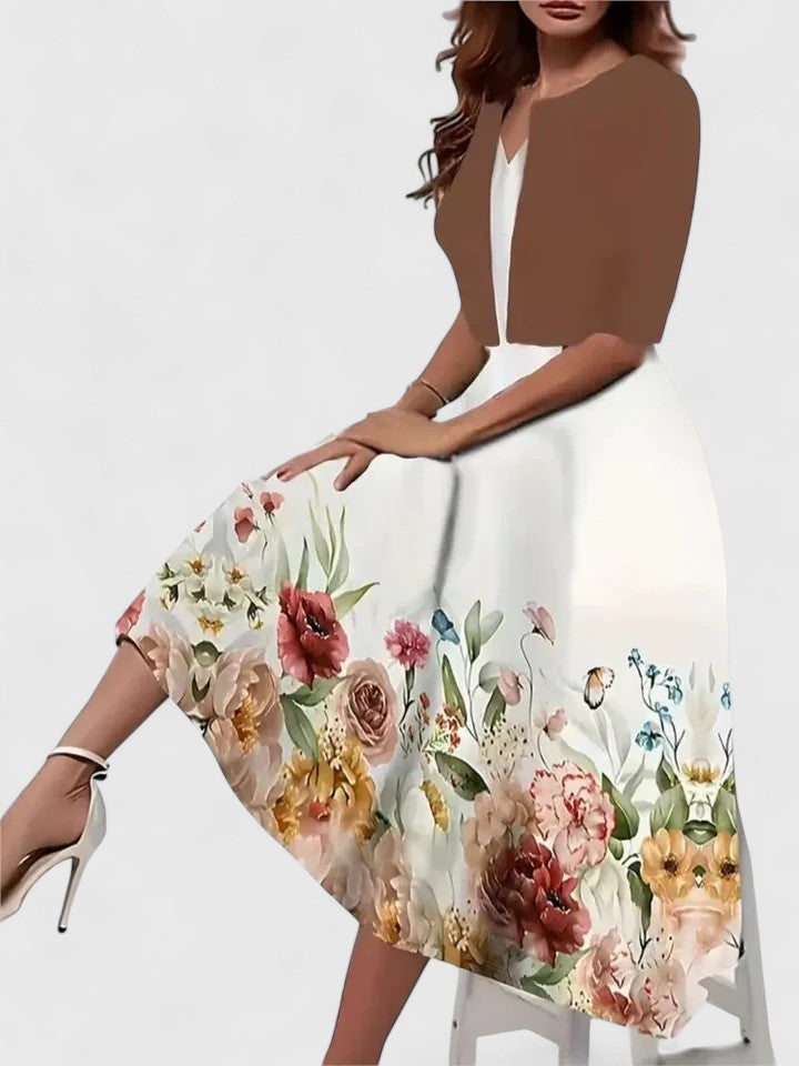 Woman wearing an Elegant Midi Floral Dress with three-quarter sleeves and vibrant floral print along the hem