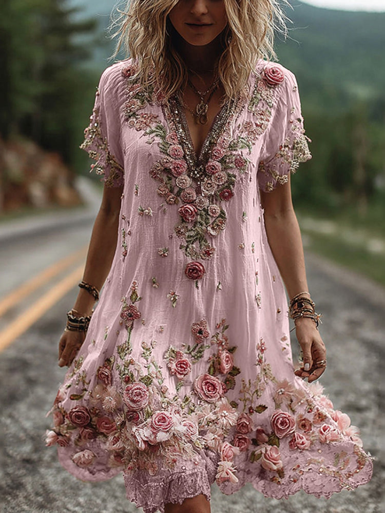 Detail shot of three-dimensional rose embroidery and embellished neckline on floral V neck dress