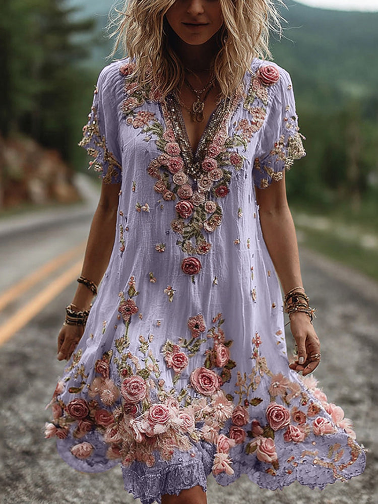Full-length view of floral embroidered V neck dress styled with layered bracelets for summer garden party