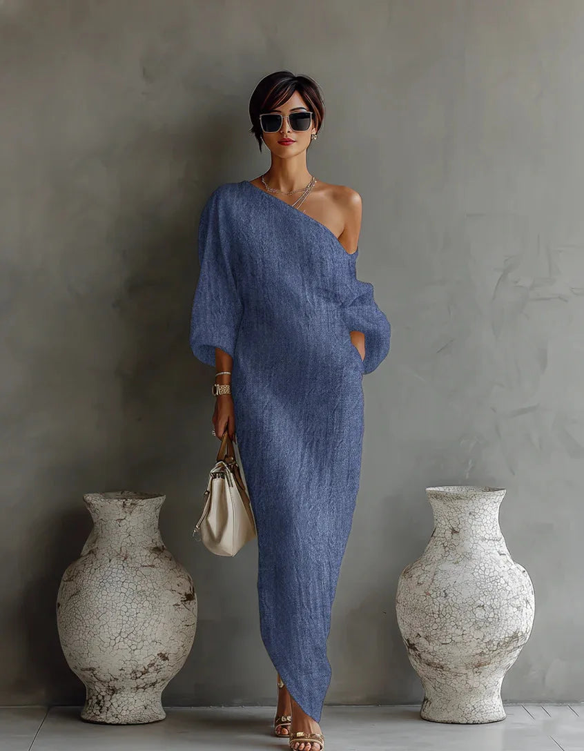 Back view of linen one shoulder dress showing asymmetrical design and textured fabric