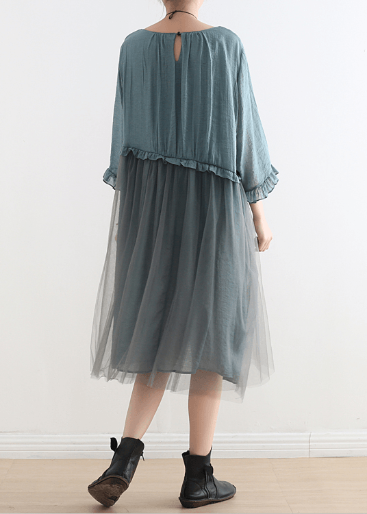 Close-up detail of layered tulle overlay and soft chiffon fabric on summer dress
