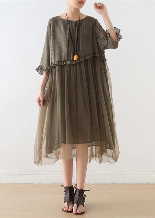 Detail of round neckline and ruffled sleeve construction on chiffon summer dress