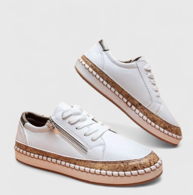 Detailed view of embroidered floral orthopedic shoes with espadrille platform styling