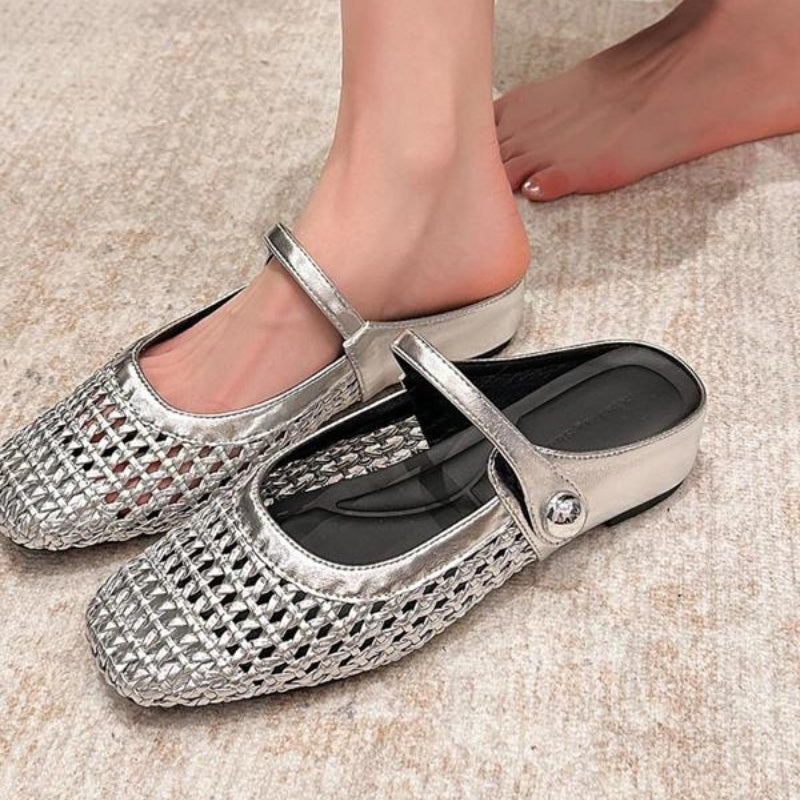 Side angle of Mary Jane mules featuring flat profile and textured woven construction
