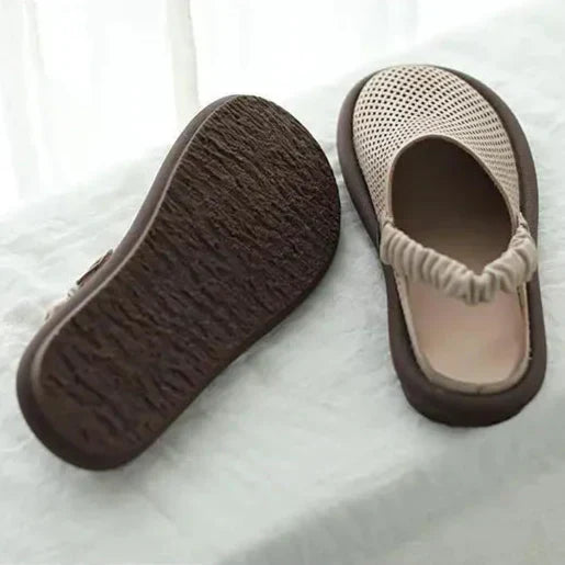 Women's cushioned sandals with adjustable straps displayed on neutral background showing rounded toe shape