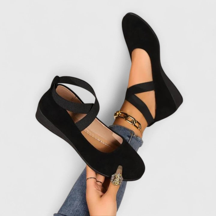 Women's Cross Strap Mary Jane Flats in black with wrap-around ankle straps and round toe design