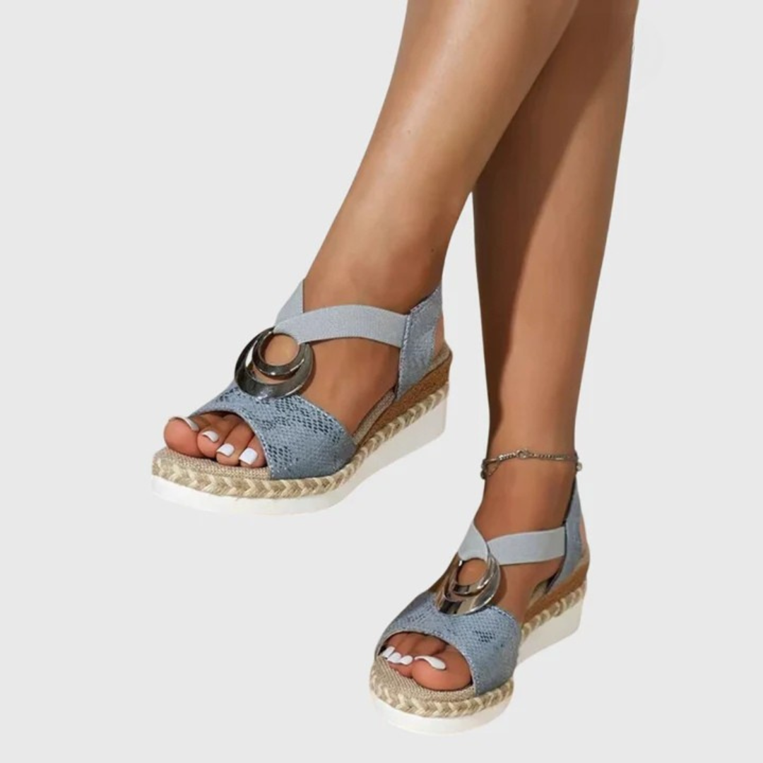 Close-up view of women's orthopedic sandals showing contoured footbed design with textured upper and espadrille-inspired platform