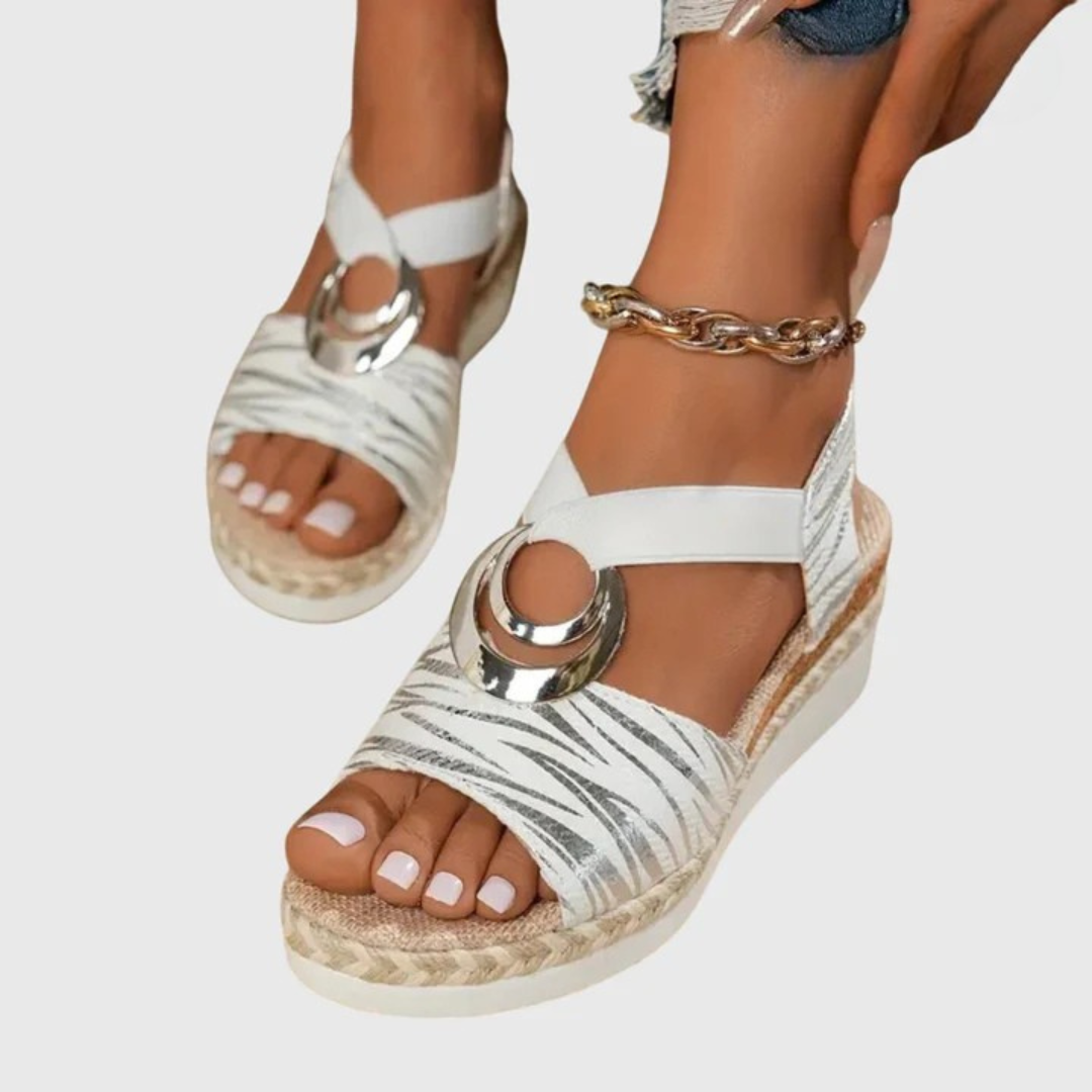 Side angle of adjustable strap orthopedic sandals featuring metallic hardware and supportive cushioned sole for all-day comfort