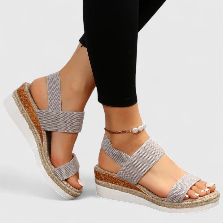 Slip-on espadrille platform sandals with wide elastic bands and slingback closure in neutral color