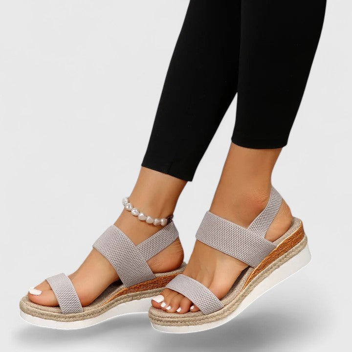 Summer comfort sandals displayed showing elastic stretch straps and natural jute-wrapped platform sole construction