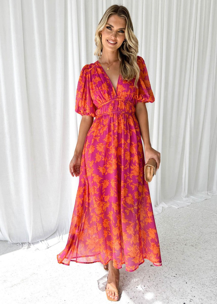 Women's Floral V Neck Maxi Wedding Guest Dress in vibrant pink and orange floral print with puff sleeves and flowing skirt