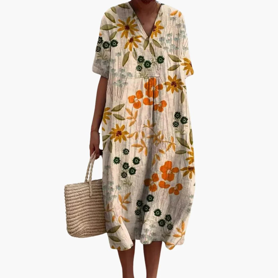 Full-length view of floral V neck midi dress paired with woven basket bag
