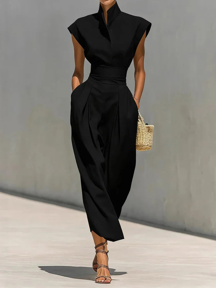 Side view of elegant midi dress showing sleeveless cut and hidden pocket detail