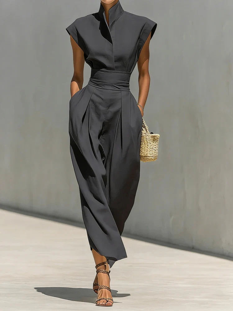 Close-up of stand collar neckline and structured shoulder line on elegant midi dress