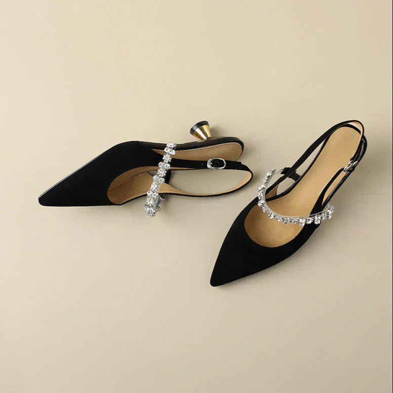 Full product view of adjustable slingback heels with crystal embellishment and pointed toe silhouette