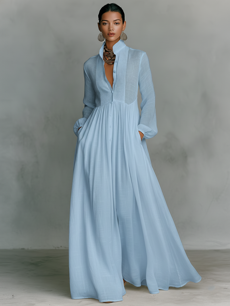 Side angle showing flowing floor-length skirt and structured bodice of cotton linen dress