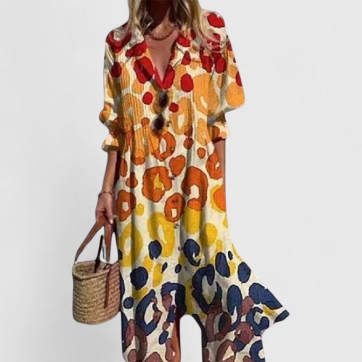 Detail of collared neckline and button closure on leaf print summer dress