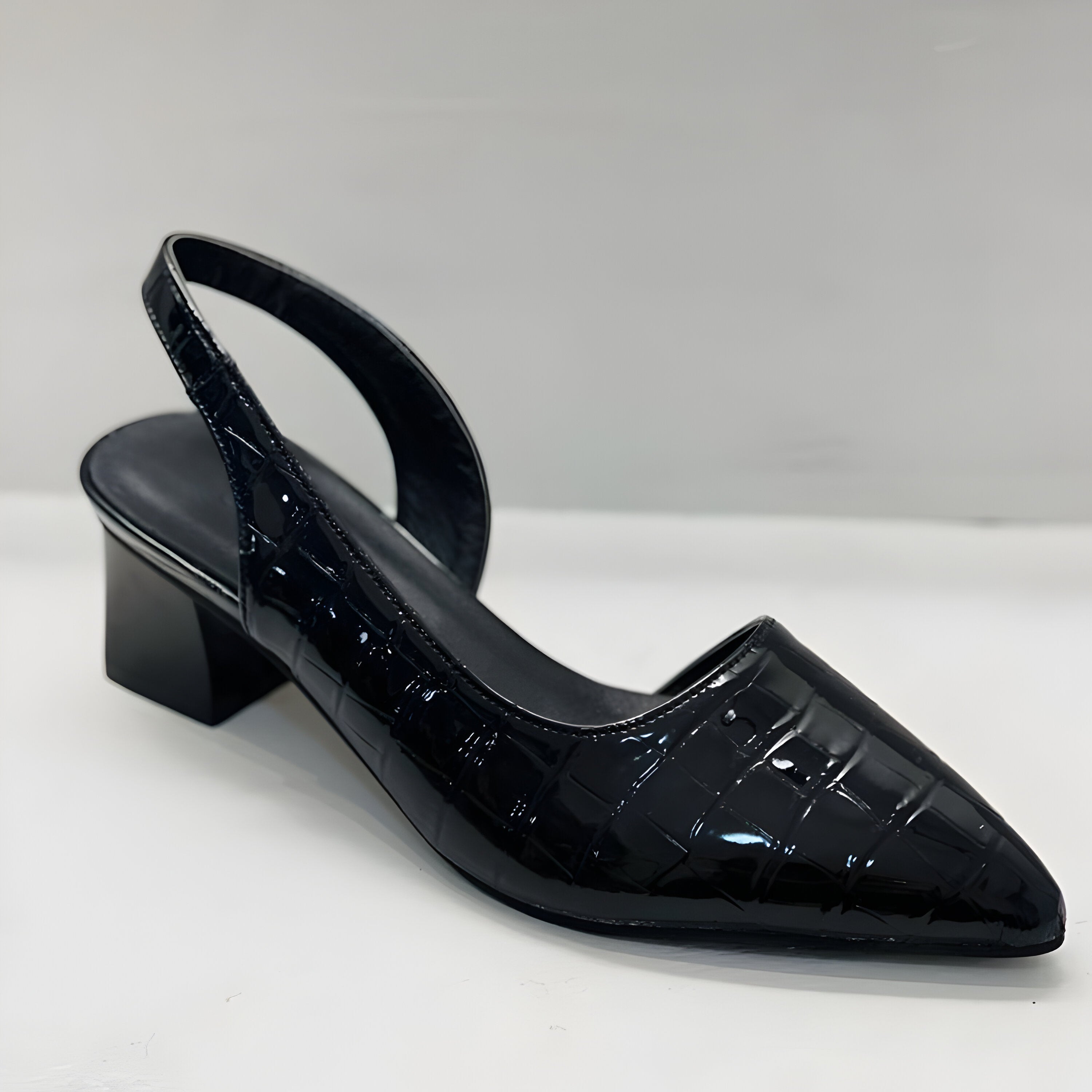 Women's orthopedic heels pointed toe styled with black trousers and silver anklet