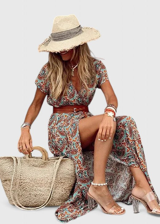 Close-up of gathered waistband detail on maxi boho dress with short sleeves and bohemian print